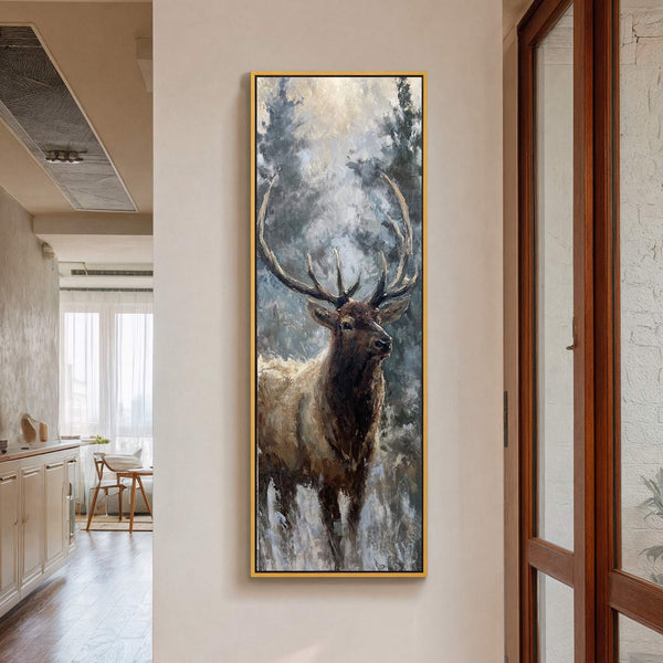 Vertical canvas wall art featuring a majestic elk in a forest, painted with a muted palette and loose brushstrokes, framed in gold, hanging on a neutral wall with a wooden.