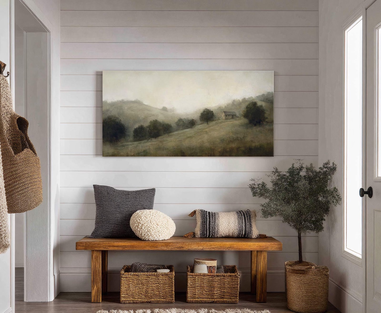This horizontal canvas print features a hazy, atmospheric landscape painting of rolling hills with trees and a small building, rendered in a muted green and beige palette. It hangs on.