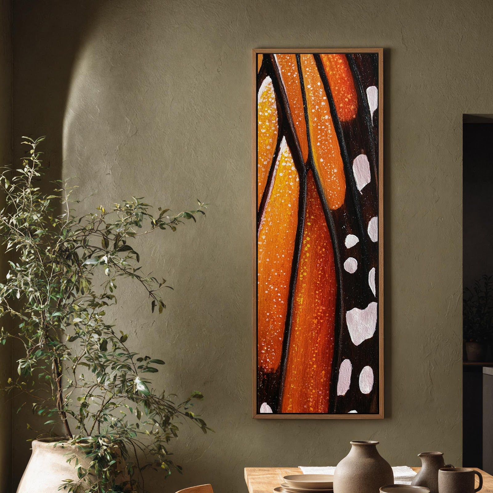 Vertical canvas wall art in interior setting.