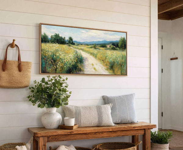 This horizontal canvas wall art depicts a pastoral landscape with a dirt path winding through a field of wildflowers, rendered in a soft, impressionistic style with a vibrant, natural palette.