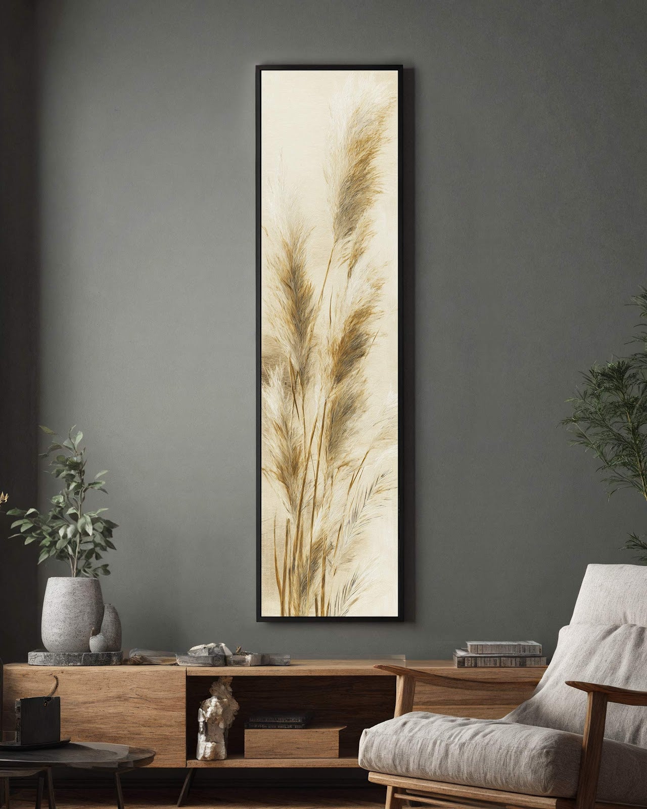 Featuring botanical pampas grass in neutral beige tones, this vertical canvas print in a black floater frame hangs above a wooden console table on a dark gray wall.