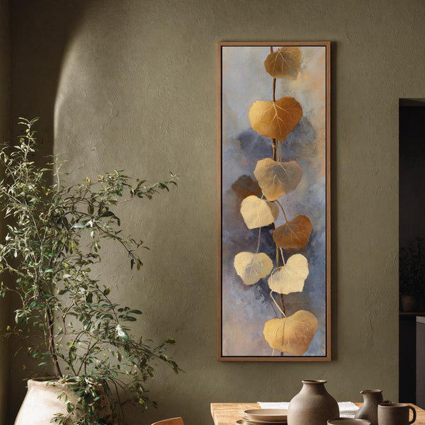 Vertical canvas wall art in interior setting.