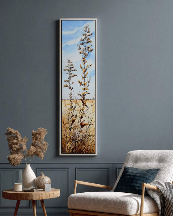 Vertical canvas wall art in interior setting.