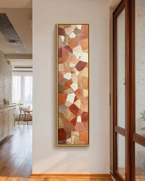 Vertical canvas wall art in interior setting.