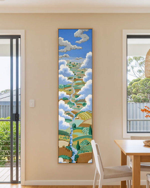 Vertical canvas wall art in interior setting.