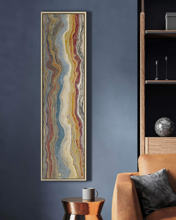 Vertical canvas wall art in interior setting.