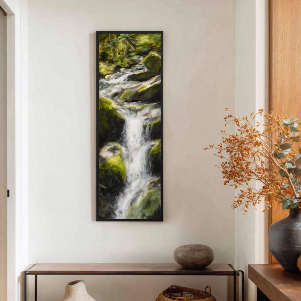 This vertical canvas wall art features a lush forest waterfall with a vibrant green and white palette in an impressionistic style, hanging on a white wall above a wooden console.
