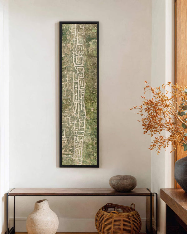 Vertical canvas wall art in interior setting.