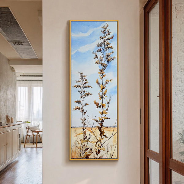 Vertical canvas wall art in interior setting.