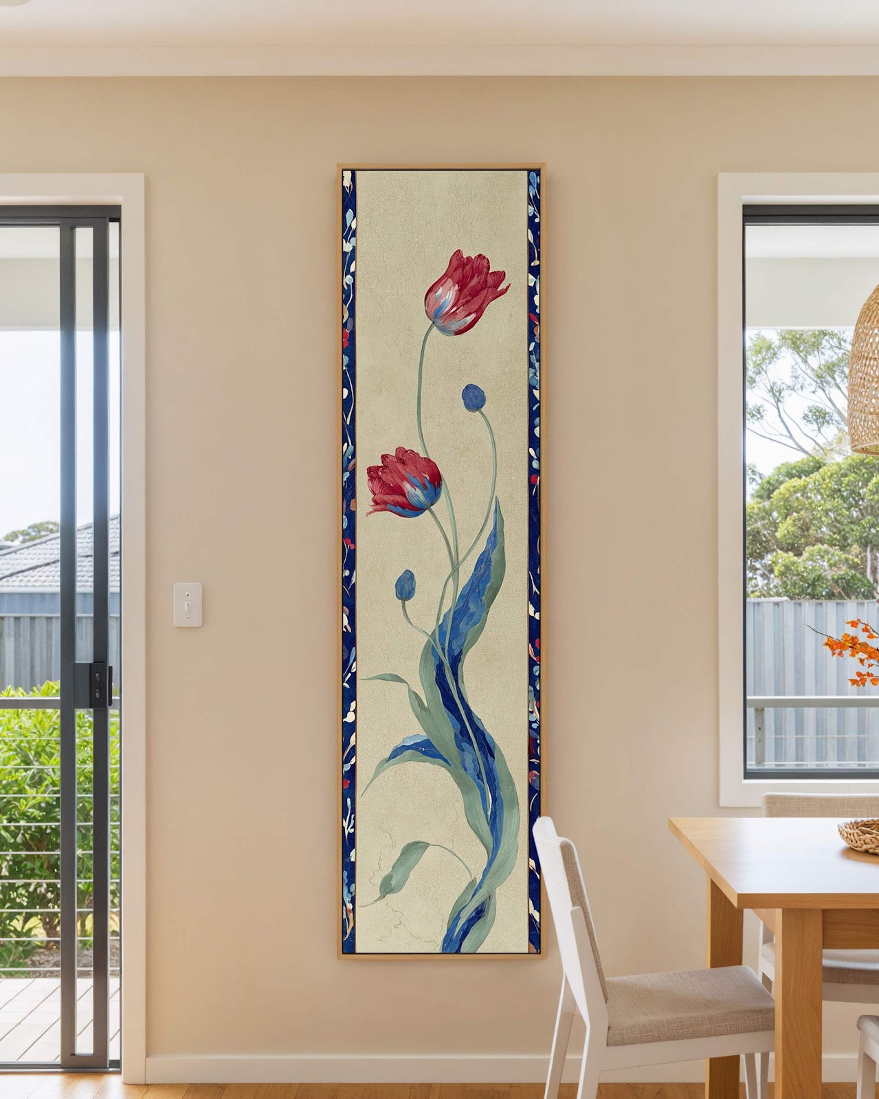 Vertical canvas wall art in interior setting.