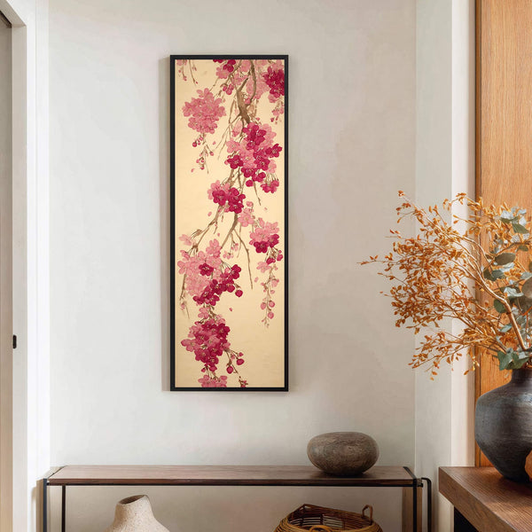 This vertical canvas wall art features a traditional Japanese-style painting of pink and red cherry blossoms against a pale gold background, framed in black and displayed on a white wall.