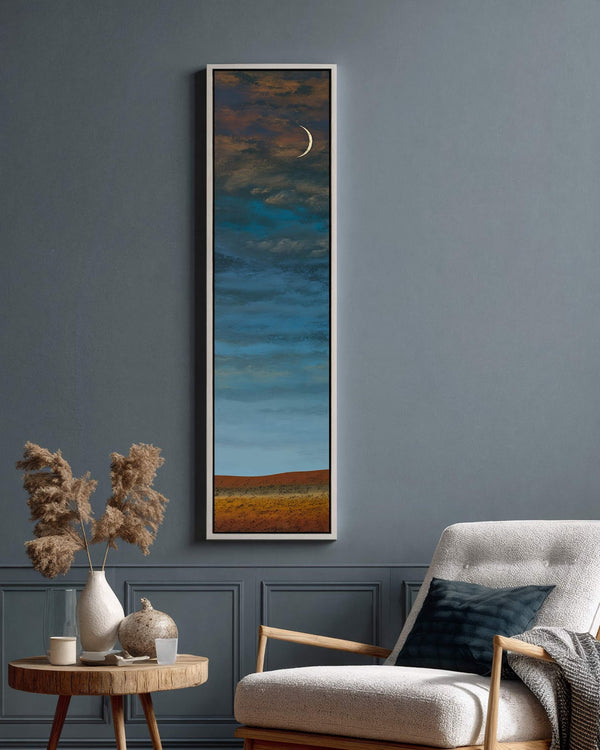 Vertical canvas wall art in interior setting.