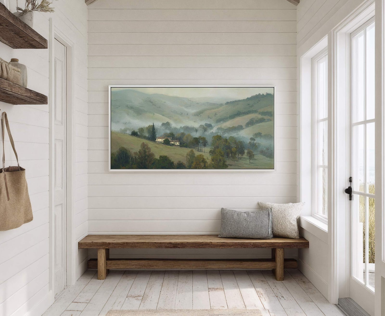This horizontal canvas wall art displays a misty, pastoral landscape with rolling hills and a distant farmhouse, rendered in a soft, painterly style with a muted green and yellow palette.