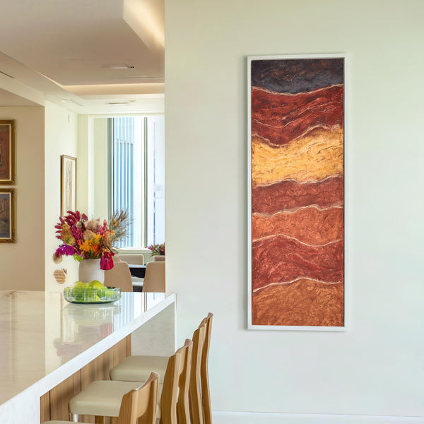 Vertical canvas wall art in interior setting.