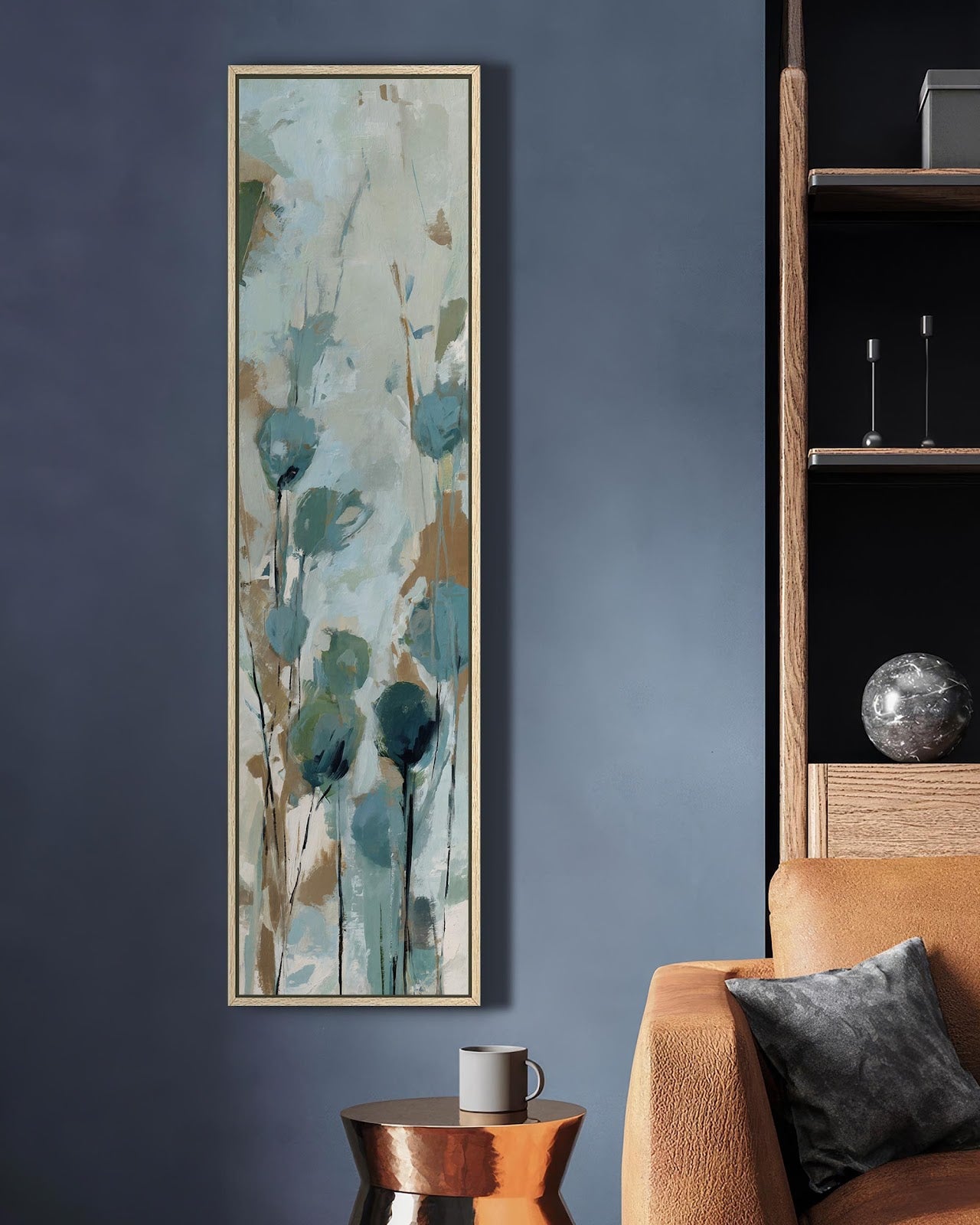 Teal abstract wildflower canvas art in natural wood floating frame on slate blue living room wall beside leather armchair, vertical botanical print