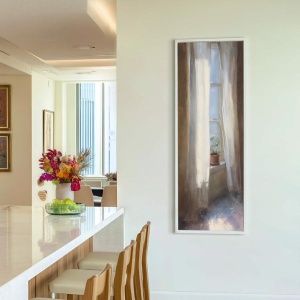 This vertical canvas wall art features a painterly style with a muted palette, depicting light streaming through a window with sheer curtains and a potted plant. It is framed in.