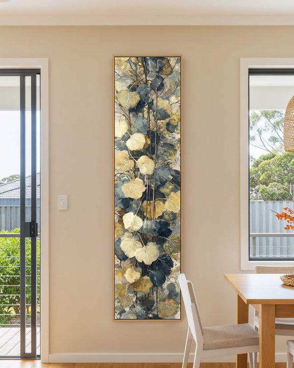 Vertical canvas wall art in interior setting.