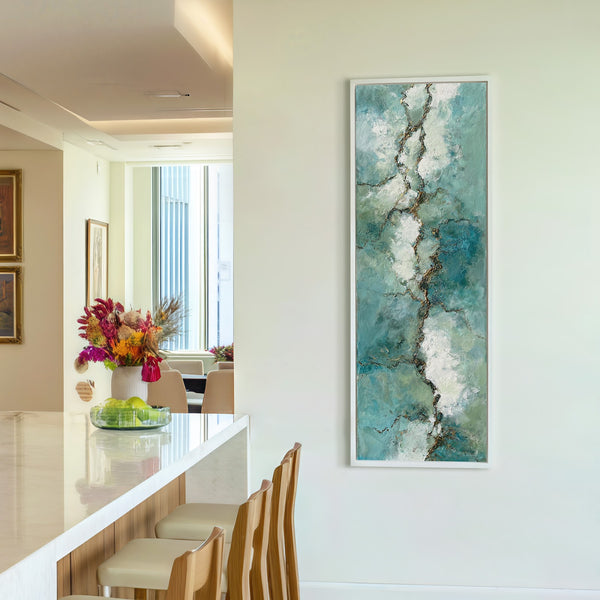 Vertical canvas wall art in interior setting.