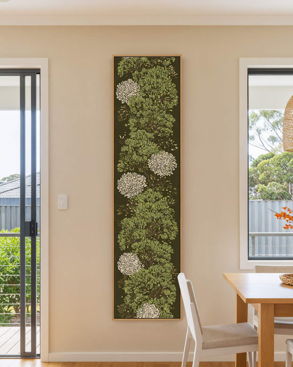 Vertical canvas wall art in interior setting.