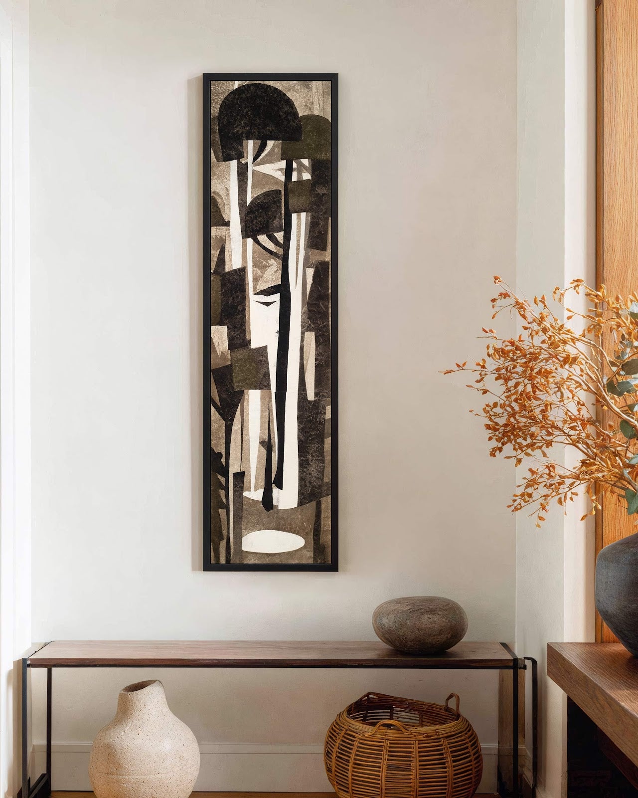 Vertical canvas wall art in interior setting.
