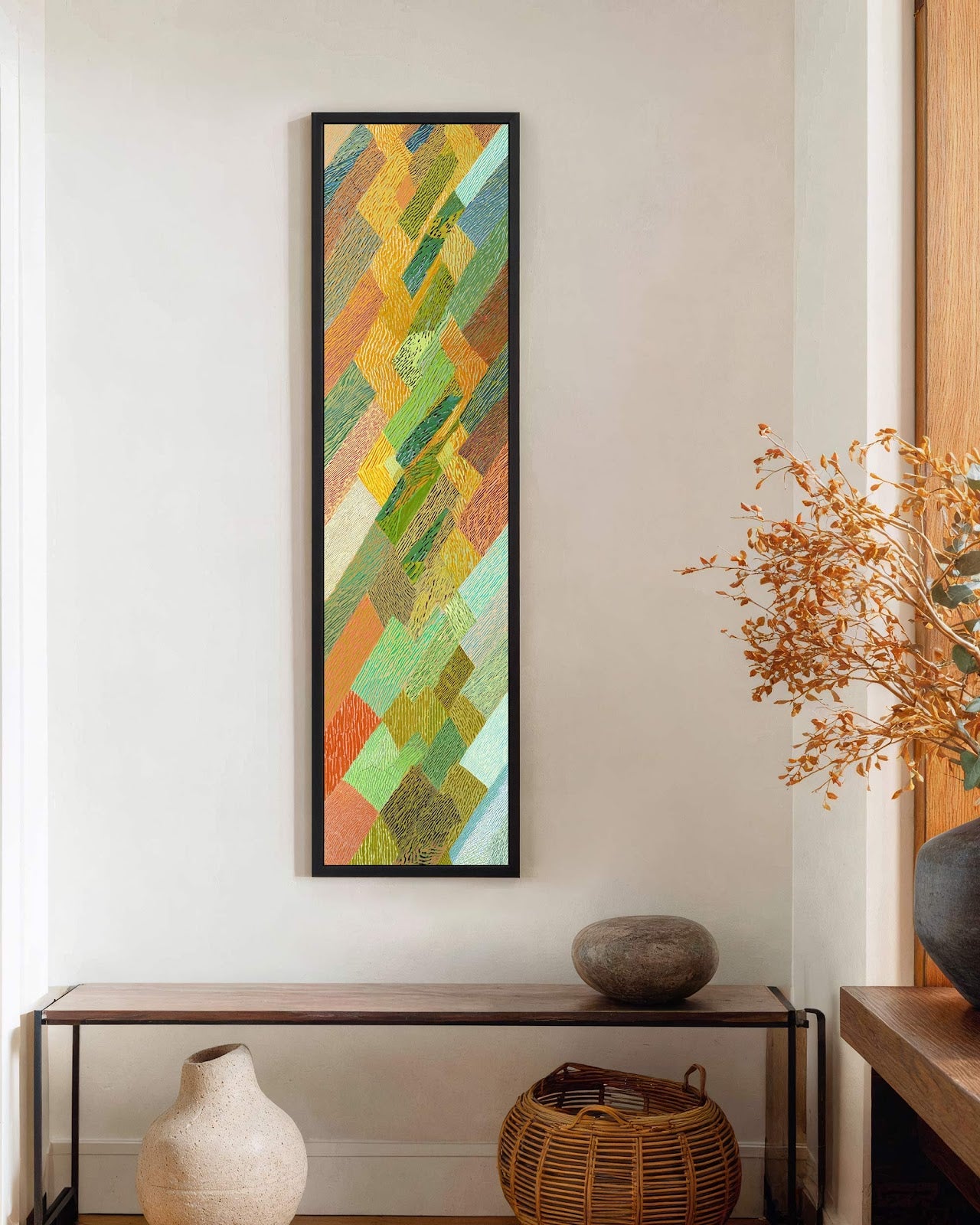 Vertical canvas wall art in interior setting.