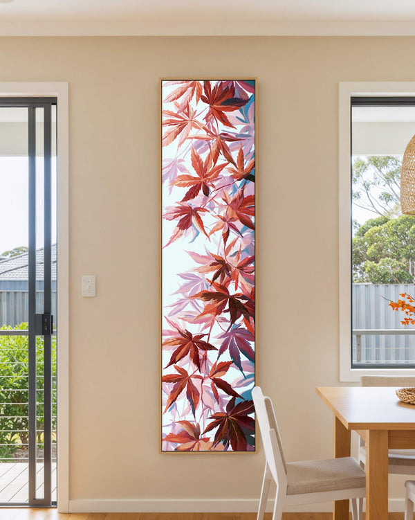 Vertical canvas wall art in interior setting.