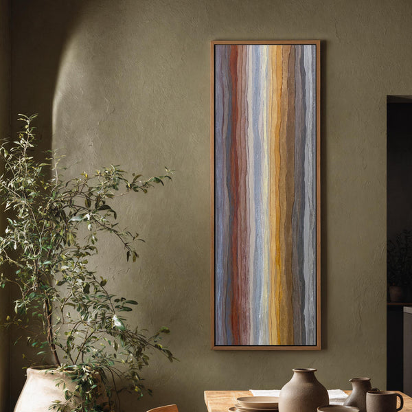 Vertical canvas wall art in interior setting.