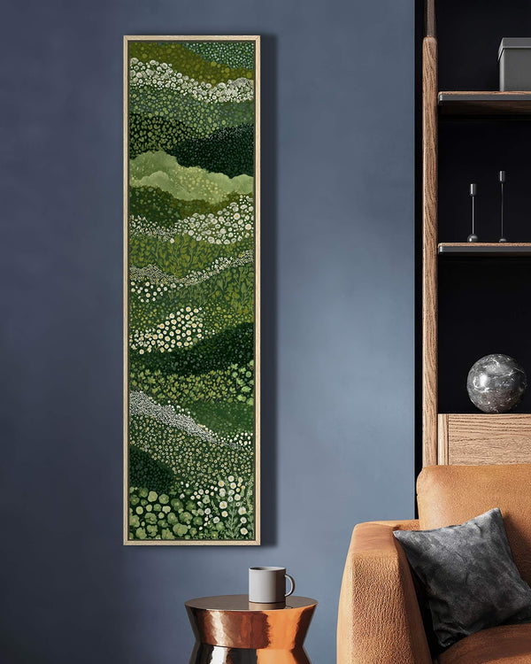 Vertical canvas wall art in interior setting.