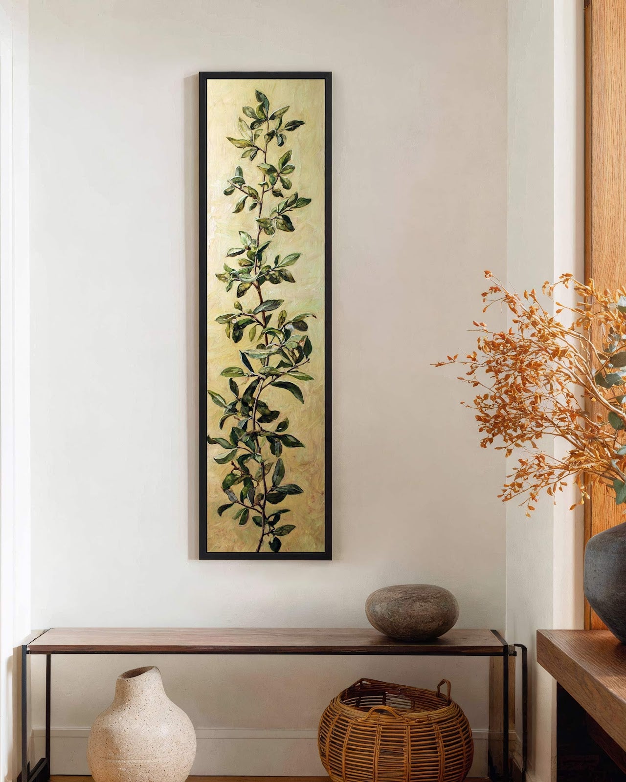 Vertical canvas wall art in interior setting.