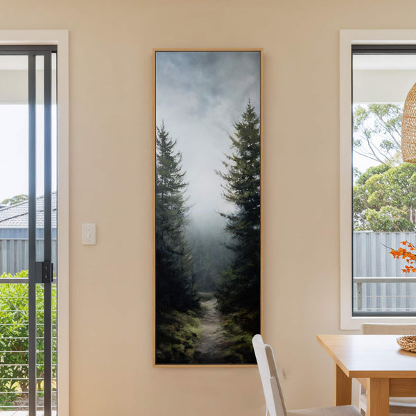 This vertical canvas print features a dark, atmospheric forest scene with pine trees on either side of a path, rendered in a realistic style with a muted palette, hanging on.