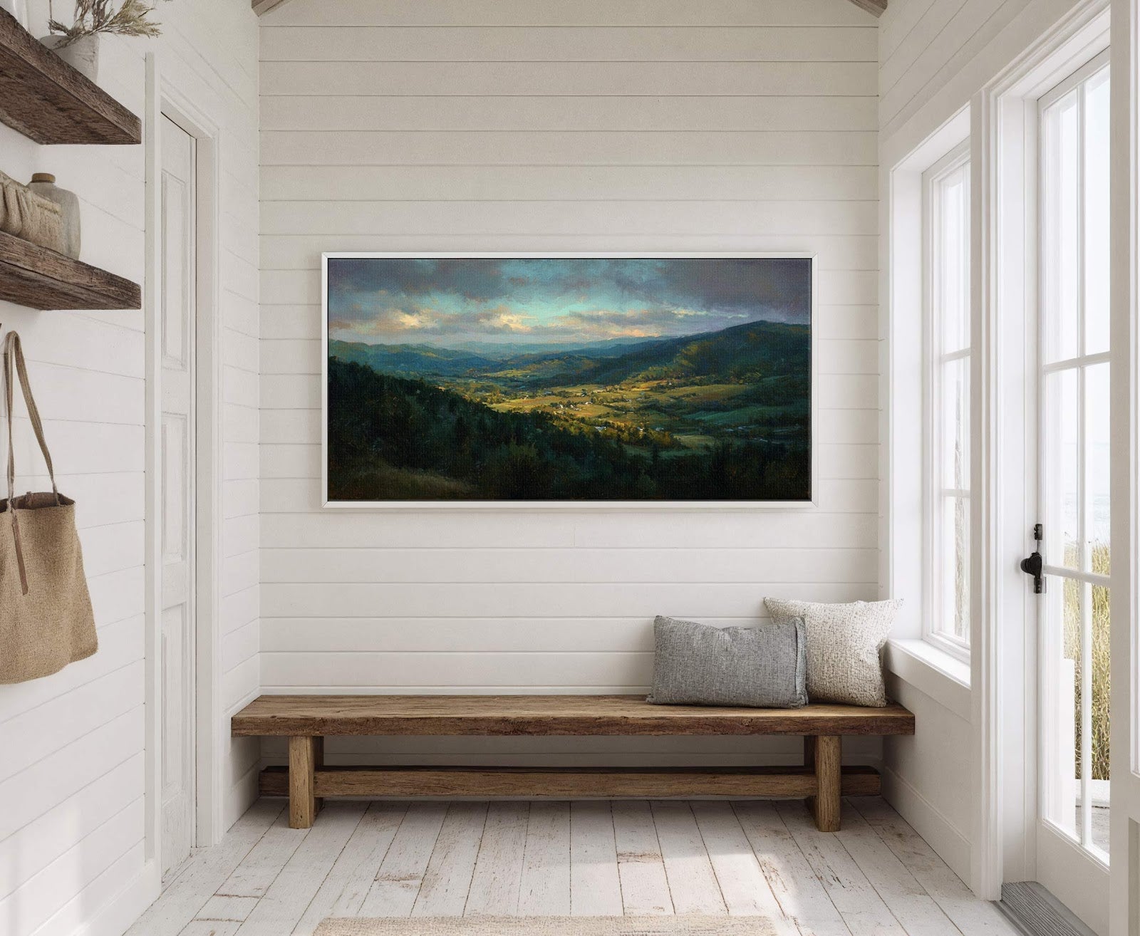 This horizontal canvas wall art features a plein air landscape painting with a rich palette of greens and blues, depicting rolling hills and a valley bathed in soft light, framed.