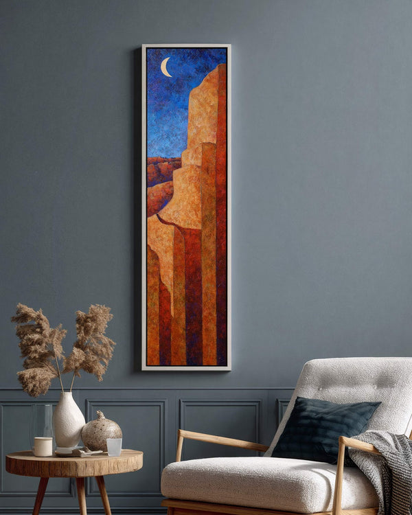 Vertical canvas wall art in interior setting.