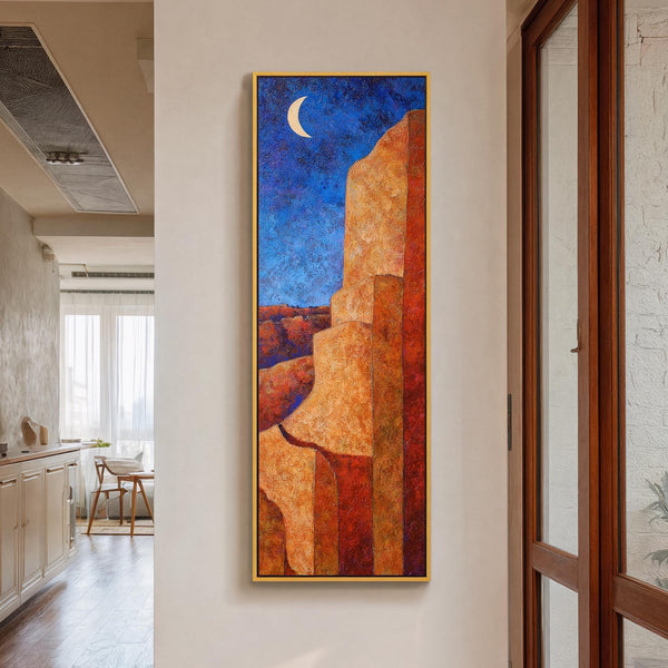 Vertical canvas wall art in interior setting.
