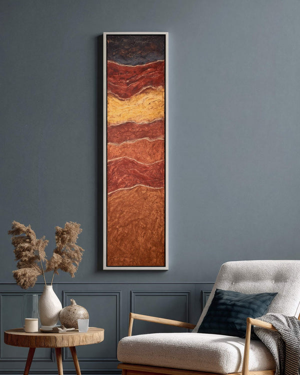 Vertical canvas wall art in interior setting.