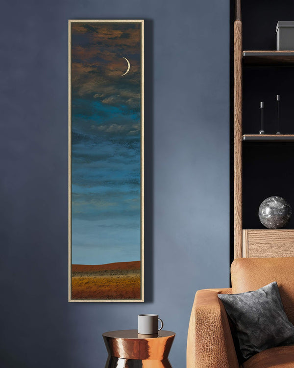 Vertical canvas wall art in interior setting.