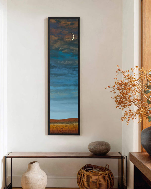 Vertical canvas wall art in interior setting.