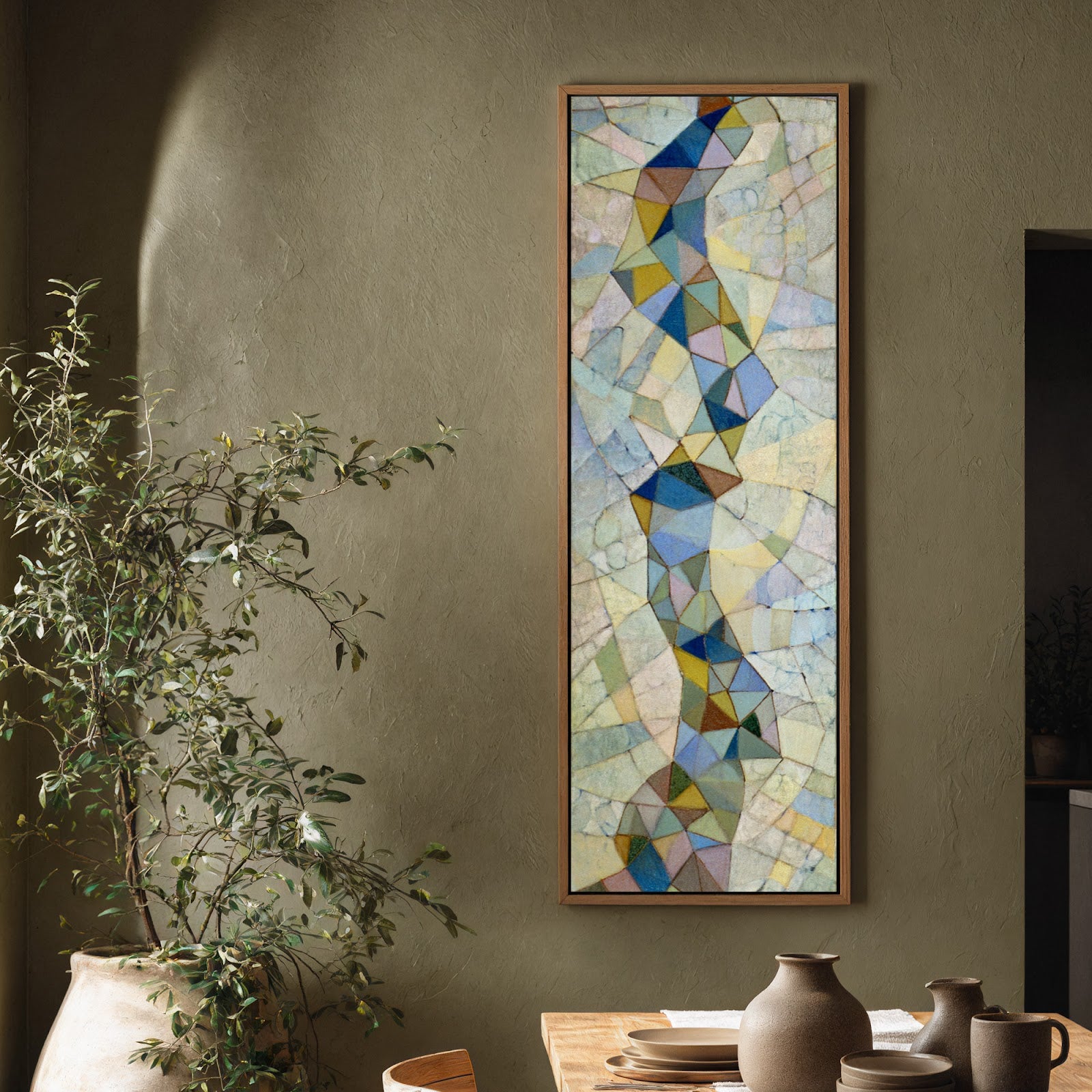 Vertical canvas wall art in interior setting.