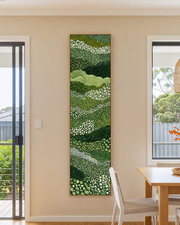Vertical canvas wall art in interior setting.