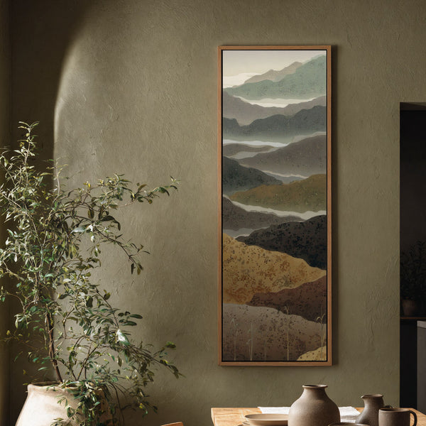 Vertical canvas wall art in interior setting.