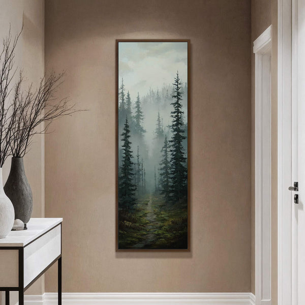 This vertical canvas wall art depicts a misty forest with a winding path, rendered in a realistic style with a muted green and gray palette. It is displayed on a.