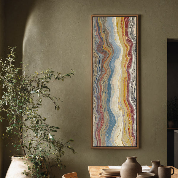 Vertical canvas wall art in interior setting.