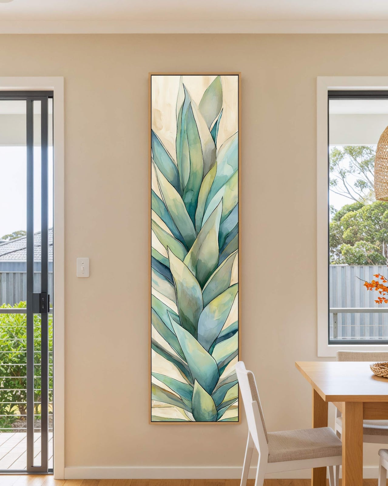 Vertical canvas wall art in interior setting.