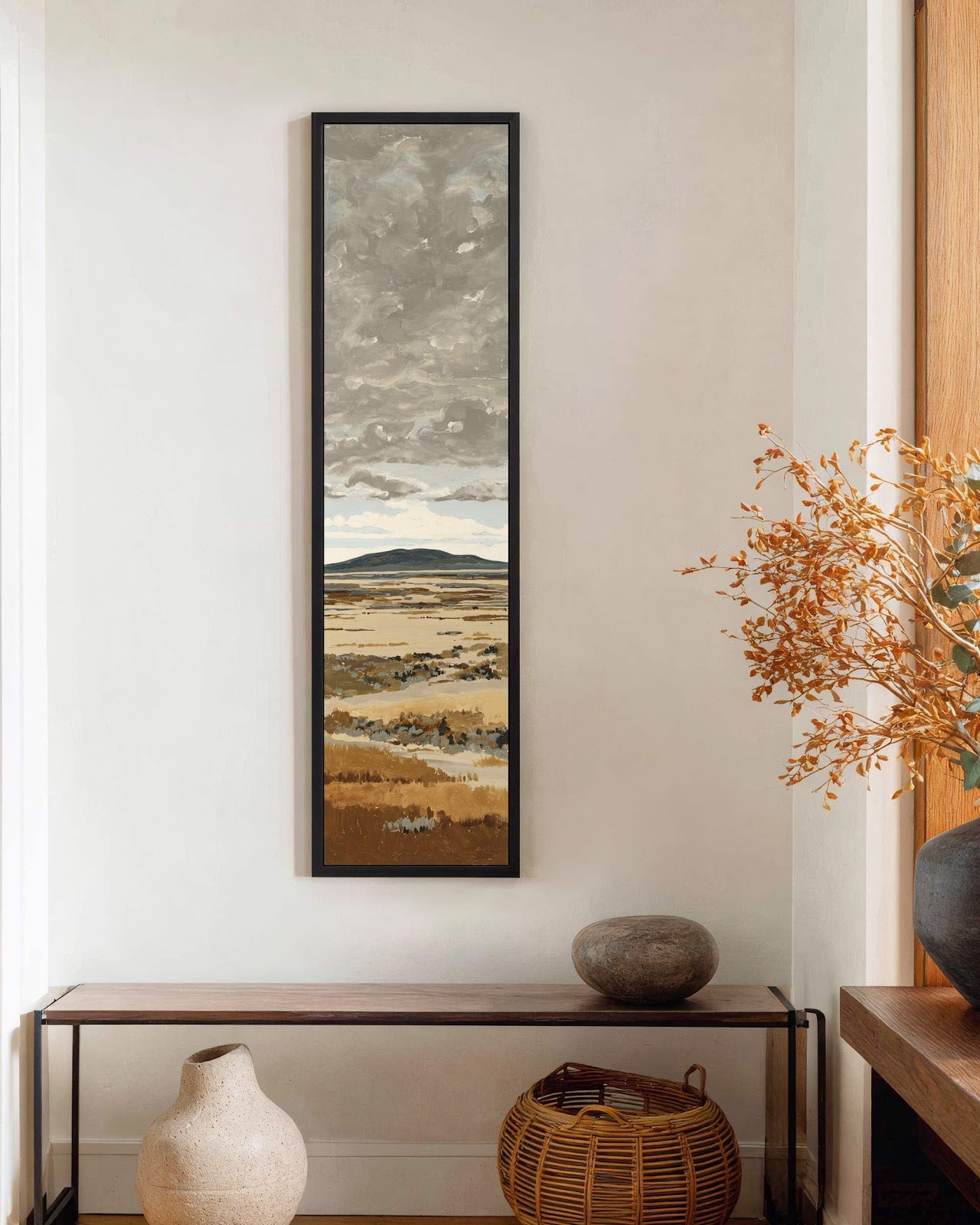 Vertical canvas wall art in interior setting.