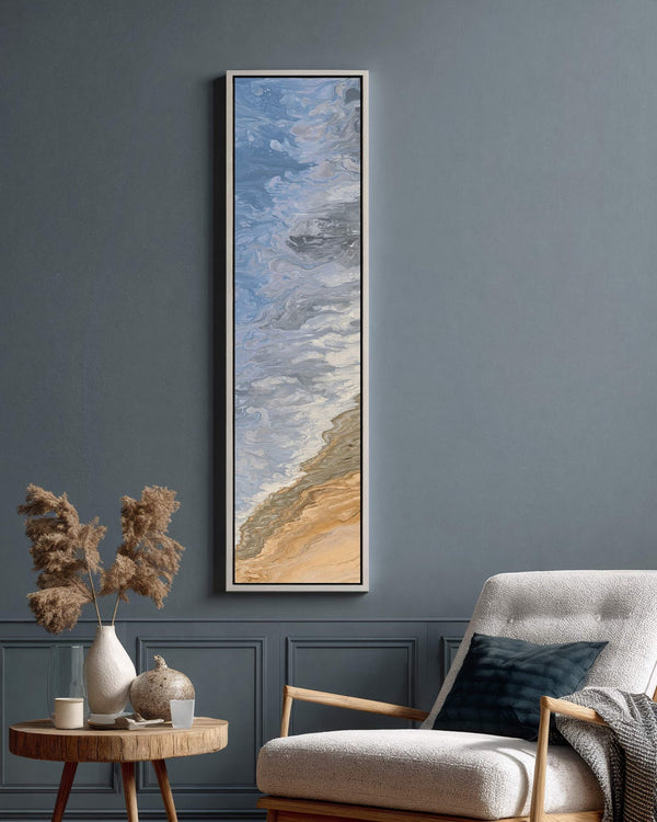 Vertical canvas wall art in interior setting.