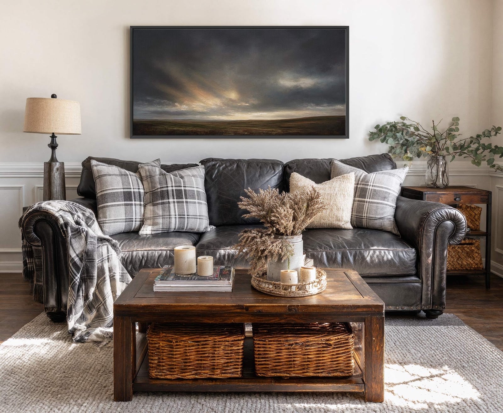 This horizontal canvas wall art features a moody landscape with dramatic clouds and sunbeams, rendered in a painterly style with a dark and earthy palette. It hangs above a dark.
