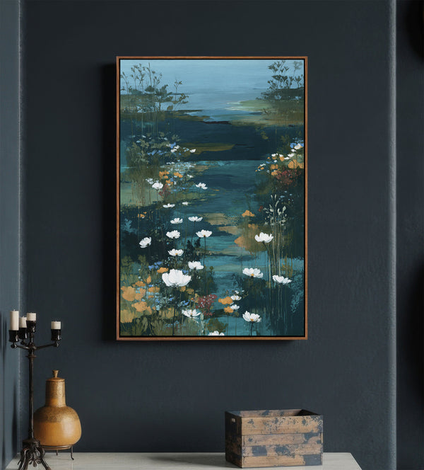Pecan framed abstract painting depicting a serene water garden with vibrant white water lilies and tall grasses amidst deep blues, teals, and greens, hung on a dark blue wall above a console table.