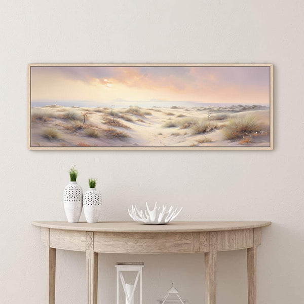 Golden Dunes desert landscape canvas wall art framed above a light wood console table with decorative accents in a modern neutral interior