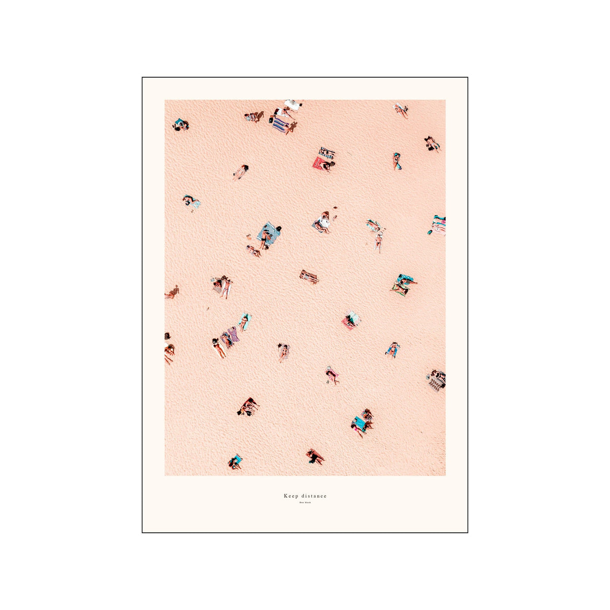 Framed aerial beach print with scattered sunbathers on pale peach sand