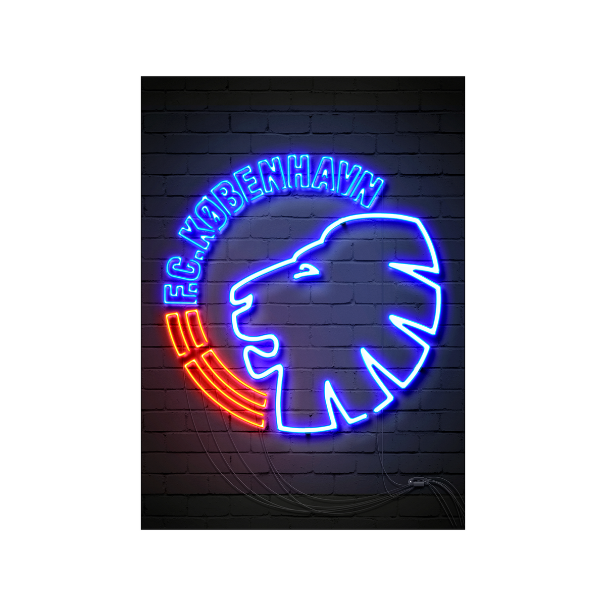 Electric blue and red neon Copenhagen sign glowing against a dark brick wall