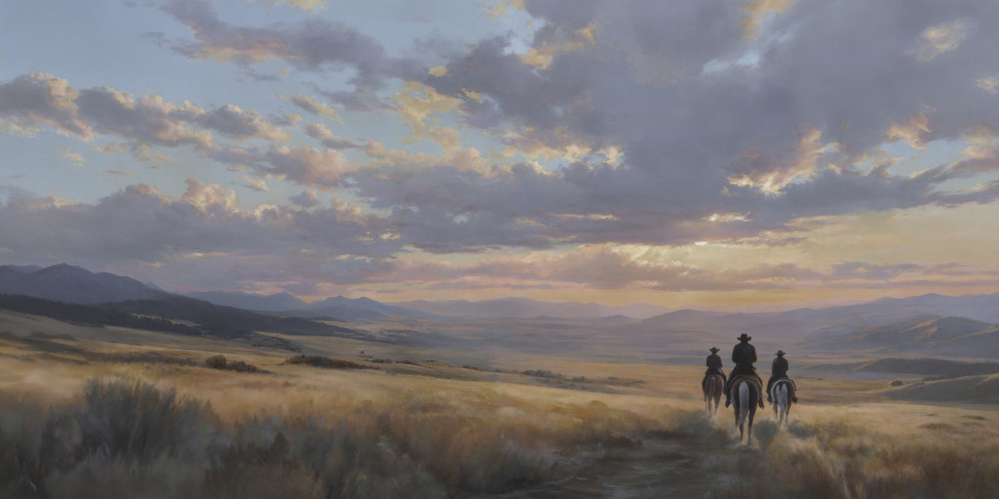 Cowboys dans un paysage de coucher de soleil de l'Ouest